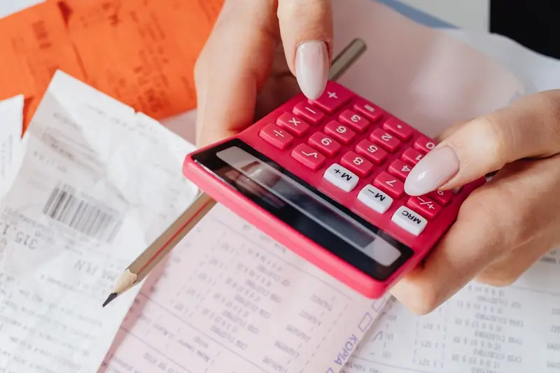 Calculator and receipts in hand, the kind of tally a water damage restoration estimate in Cary, NC involves